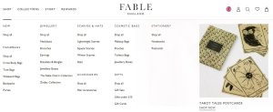 Fable England product categories including jewelry, scarves and hats, accessories, gifts, cosmetic bags and stationery. On the right hand side are tarot tales post cards.