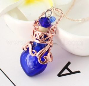 lampwork perfume bottle pendant necklace, rose gold titanium steel metal holder and dark blue perfume bottle design.