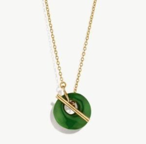Soko's neclace with green circular pendant